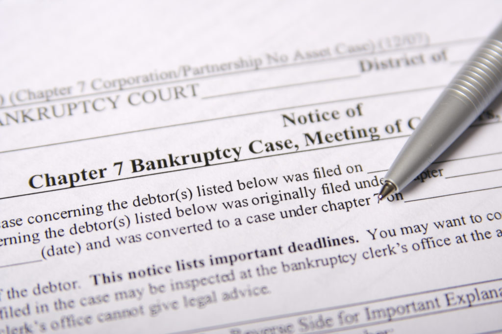 A photograph displaying a petition for Chapter 7 Bankruptcy